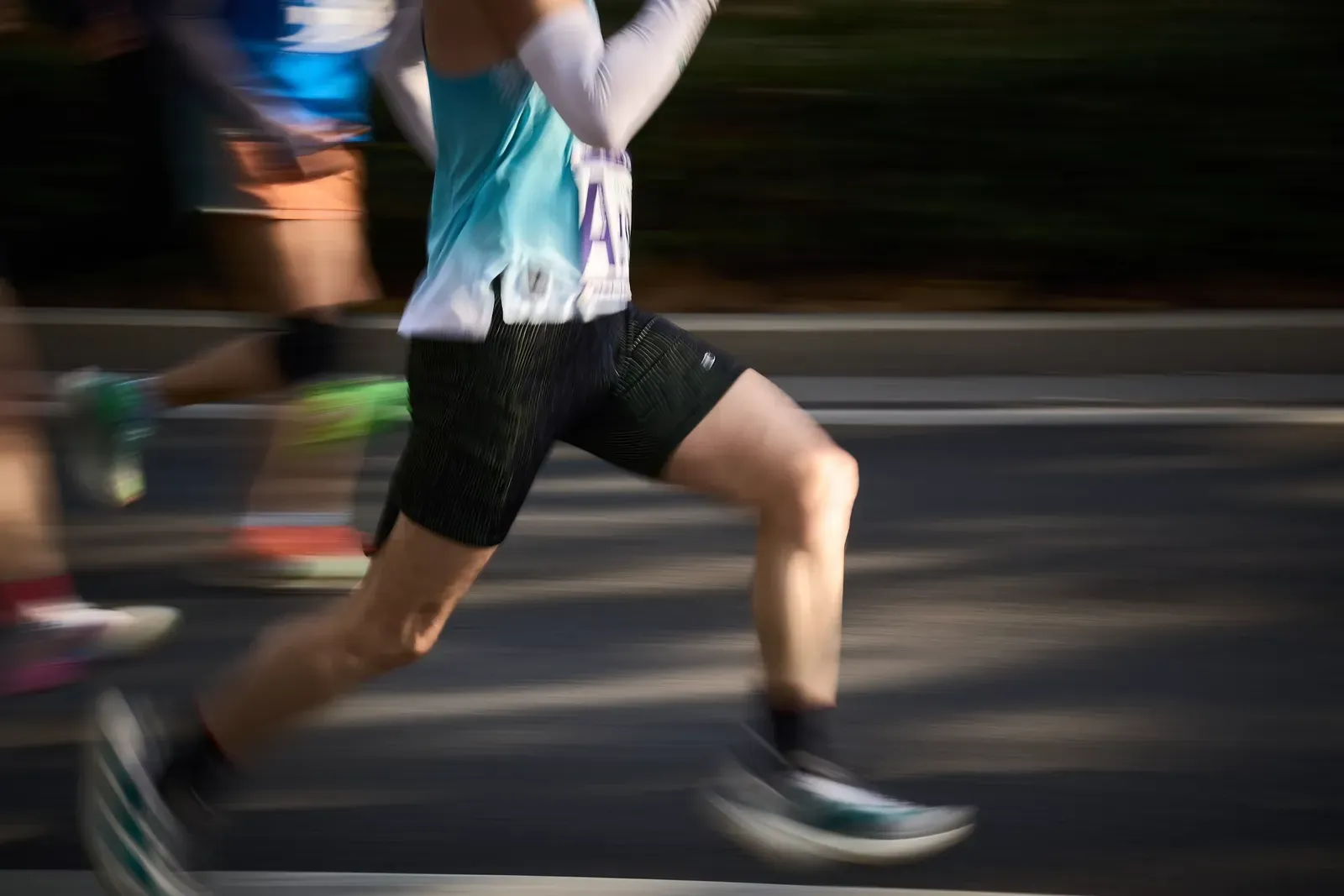A runner jogging easily on an open road during the final week before a race