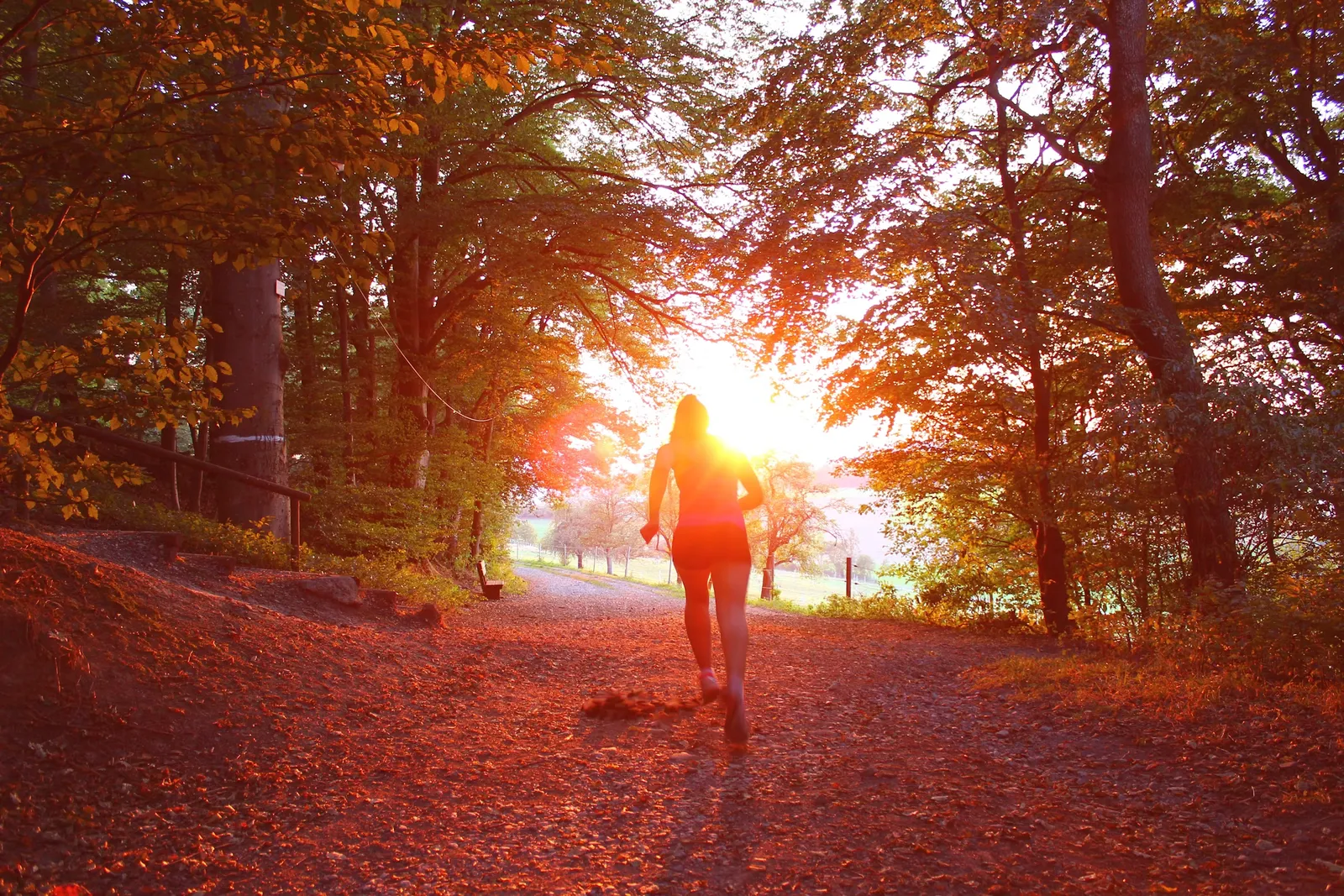 A runner out for a training run on an exposed road in changeable weather